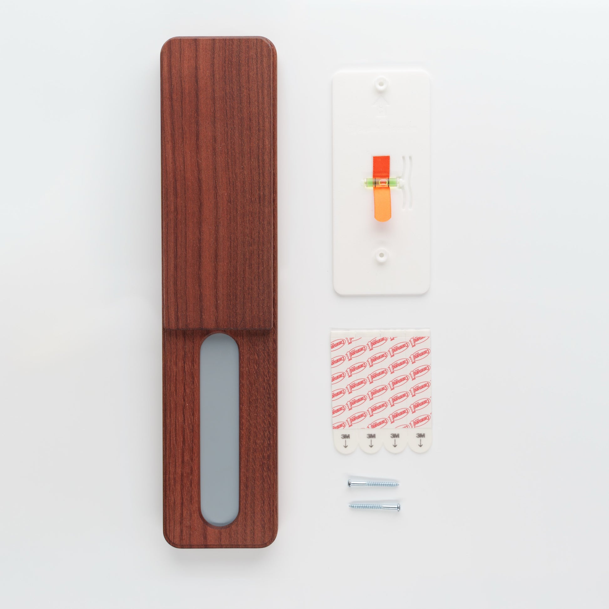 Wooden packaging with a clear window, white card, and colorful stickers on a light gray background